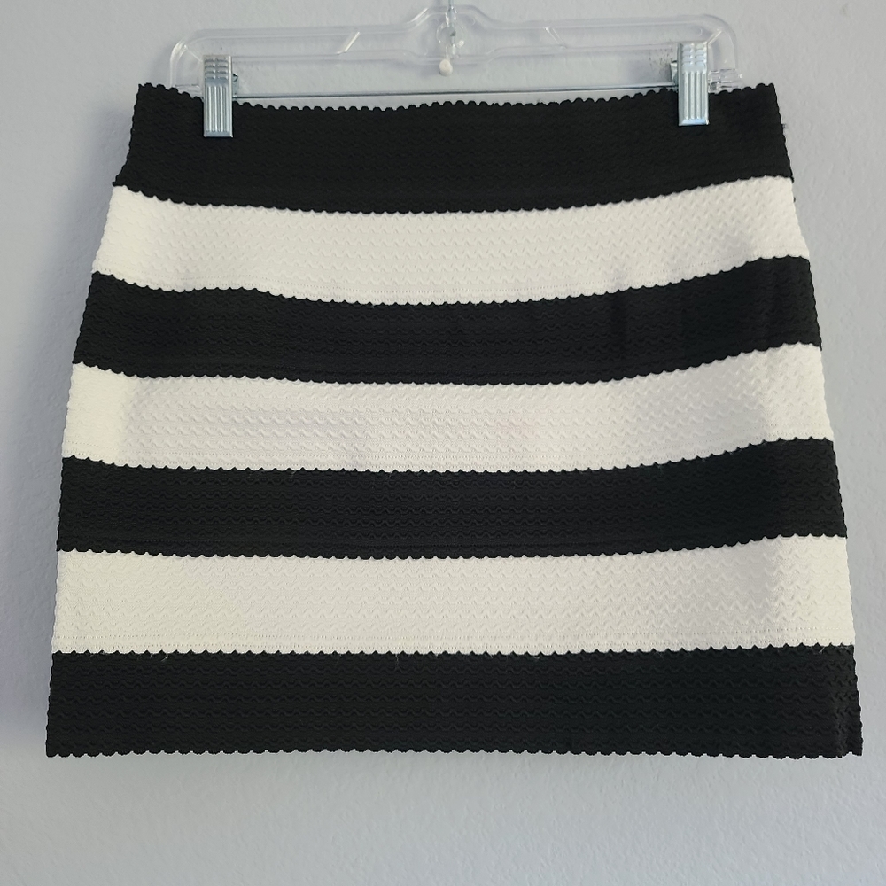 Have New with tags striped mini skirt black and white size Large